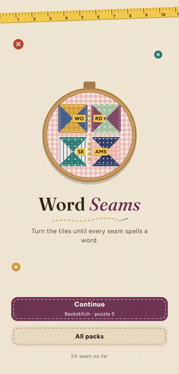 The Word Seams title screen: an embroidery hoop with WORD SEAMS stitched across a patchwork